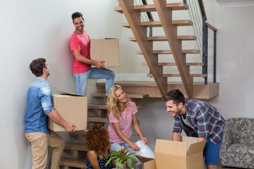 Removal van and moving team in a Swiss Cottage residential street