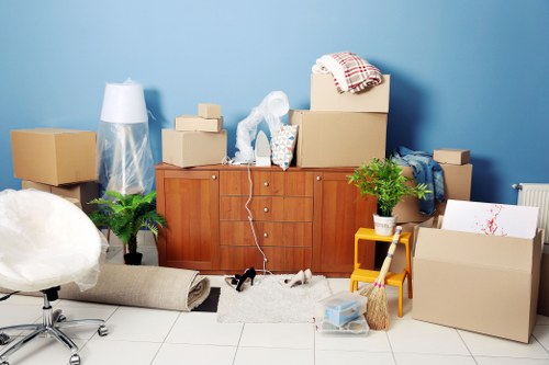 Loading furniture into a moving van near Swiss Cottage flats