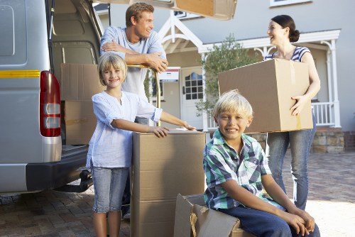 Packed boxes and furniture ready for transport during a flat move