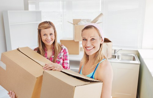 Packed moving boxes and furniture ready for transport