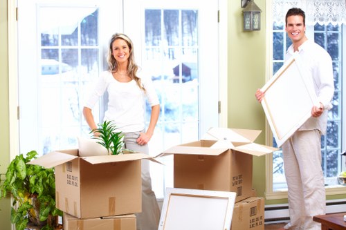 Loading household items into a van in Swiss Cottage